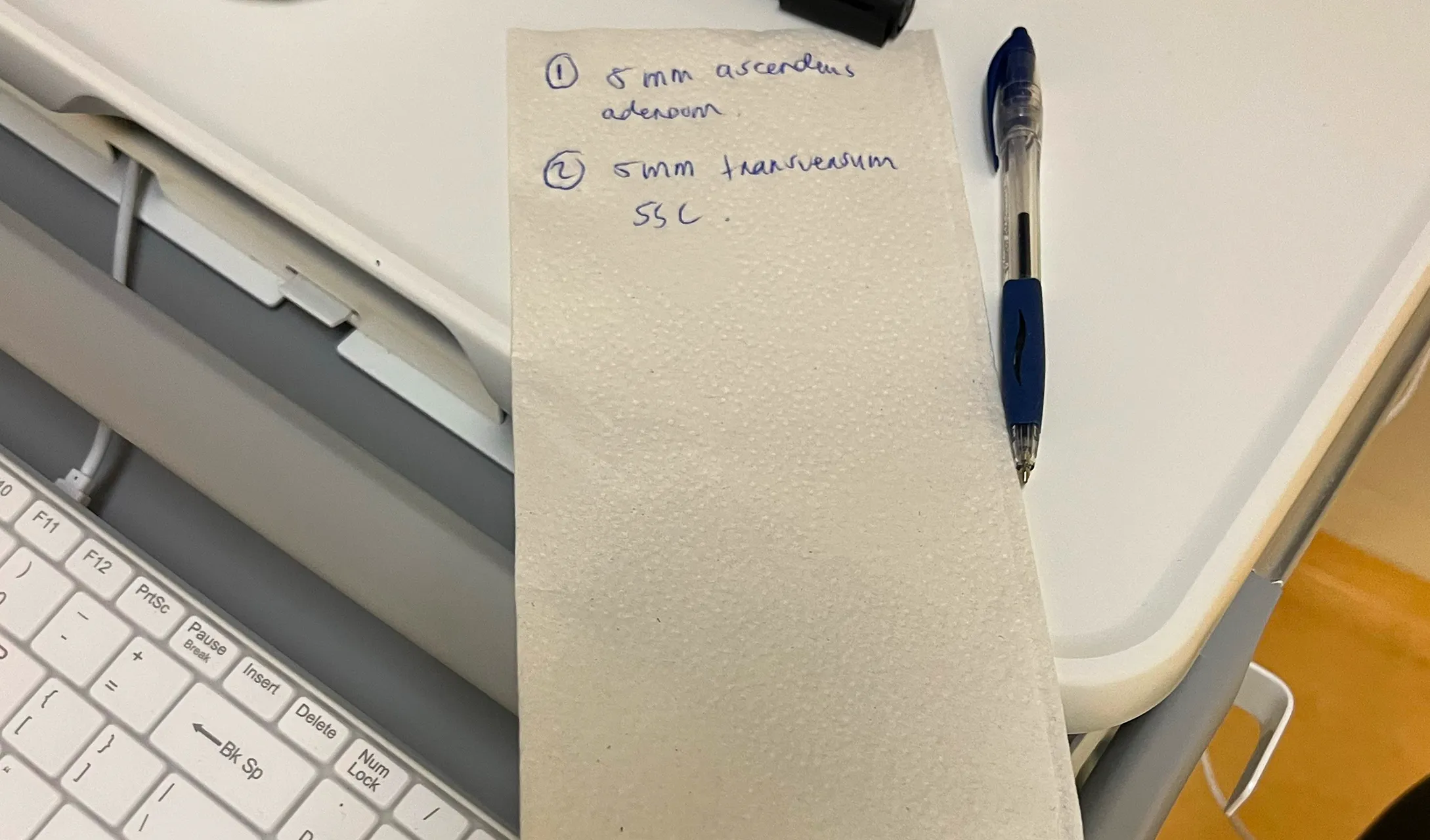Resection details written on a piece of scrap paper